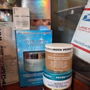 Peter Thomas Roth skincare jars in white, blue, gold packaging